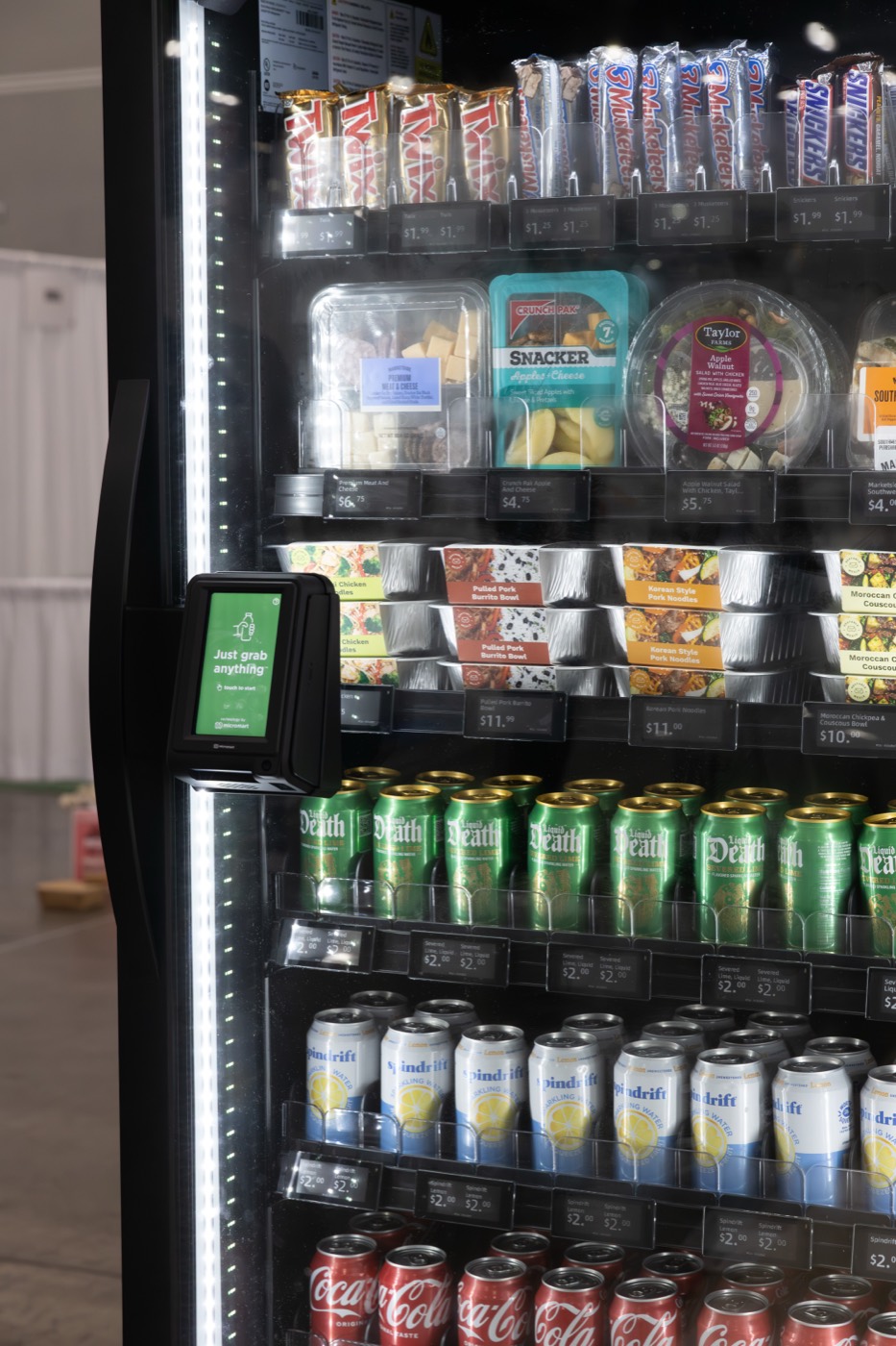 Shelves of chilled drinks, snacks, and fresh food inside a VendBeast cooler